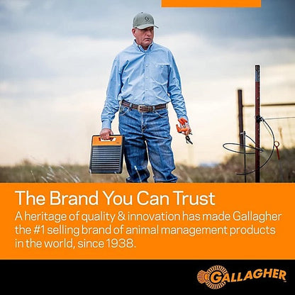Cattle Farmer holding S120 Electric Fence energizer in a farm field with Gallagher branding text